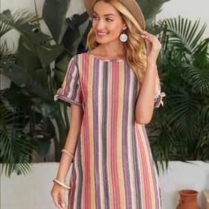 Cute stripped dress! Buttons down the backside ! Size L